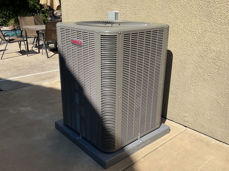 Lennox air conditioning condenser beside a swimming pool